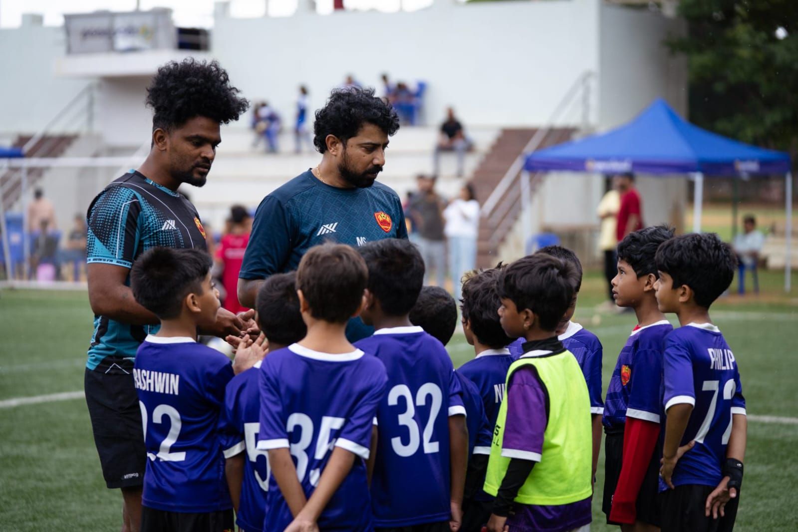 Roots Football coaches training young grassroots players